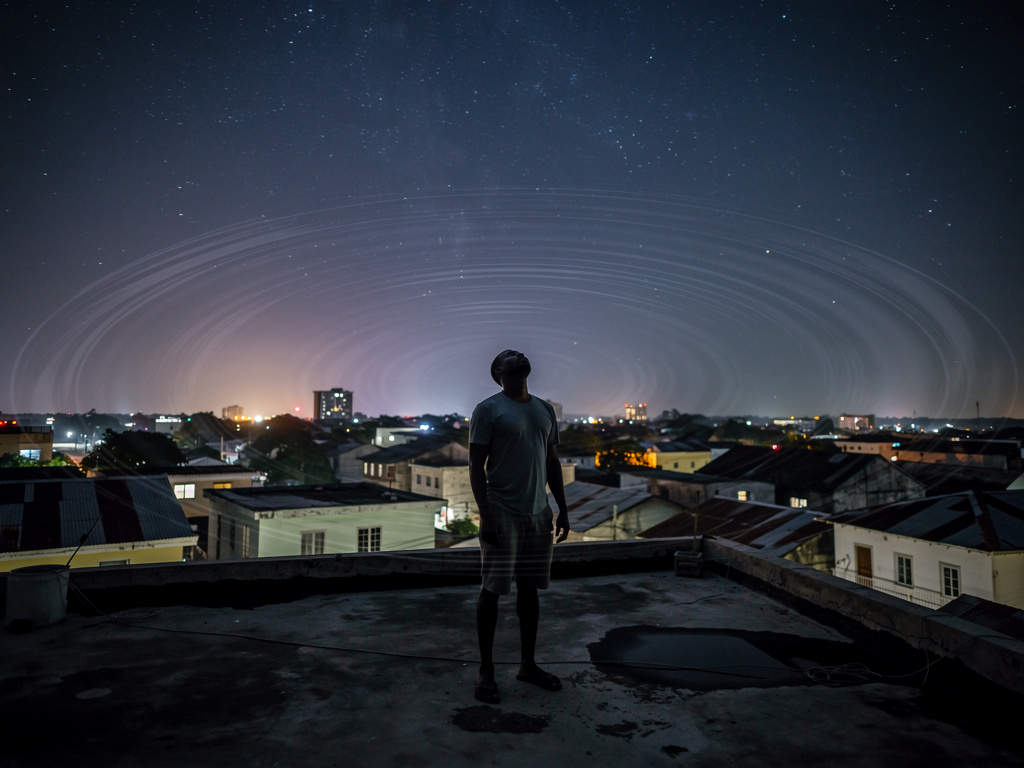 Imagine if: The night sky over Georgetown, Demerara-Mahaica, Guyana was silent… too silent.
The stars above flickered like so